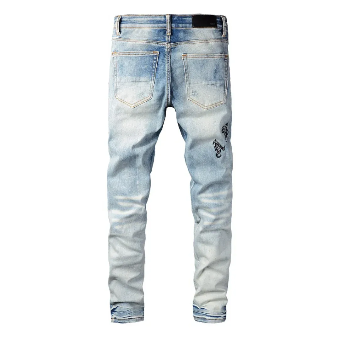 AMIRI BLUE DISTRESSED JEANS