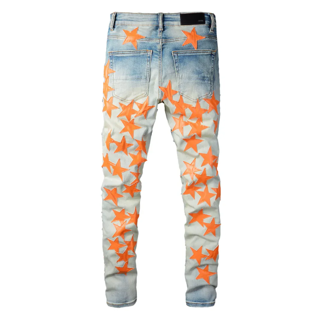 AMIRI ORANGE STAR PATCH JEANS