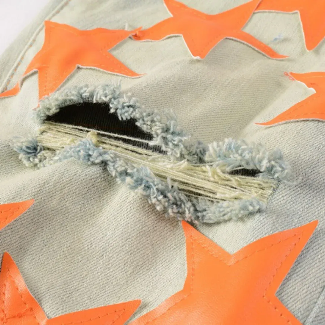 AMIRI ORANGE STAR PATCH JEANS