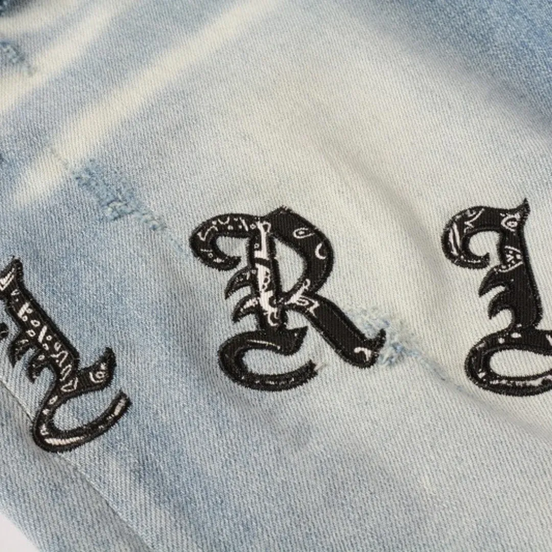 AMIRI BLUE DISTRESSED JEANS