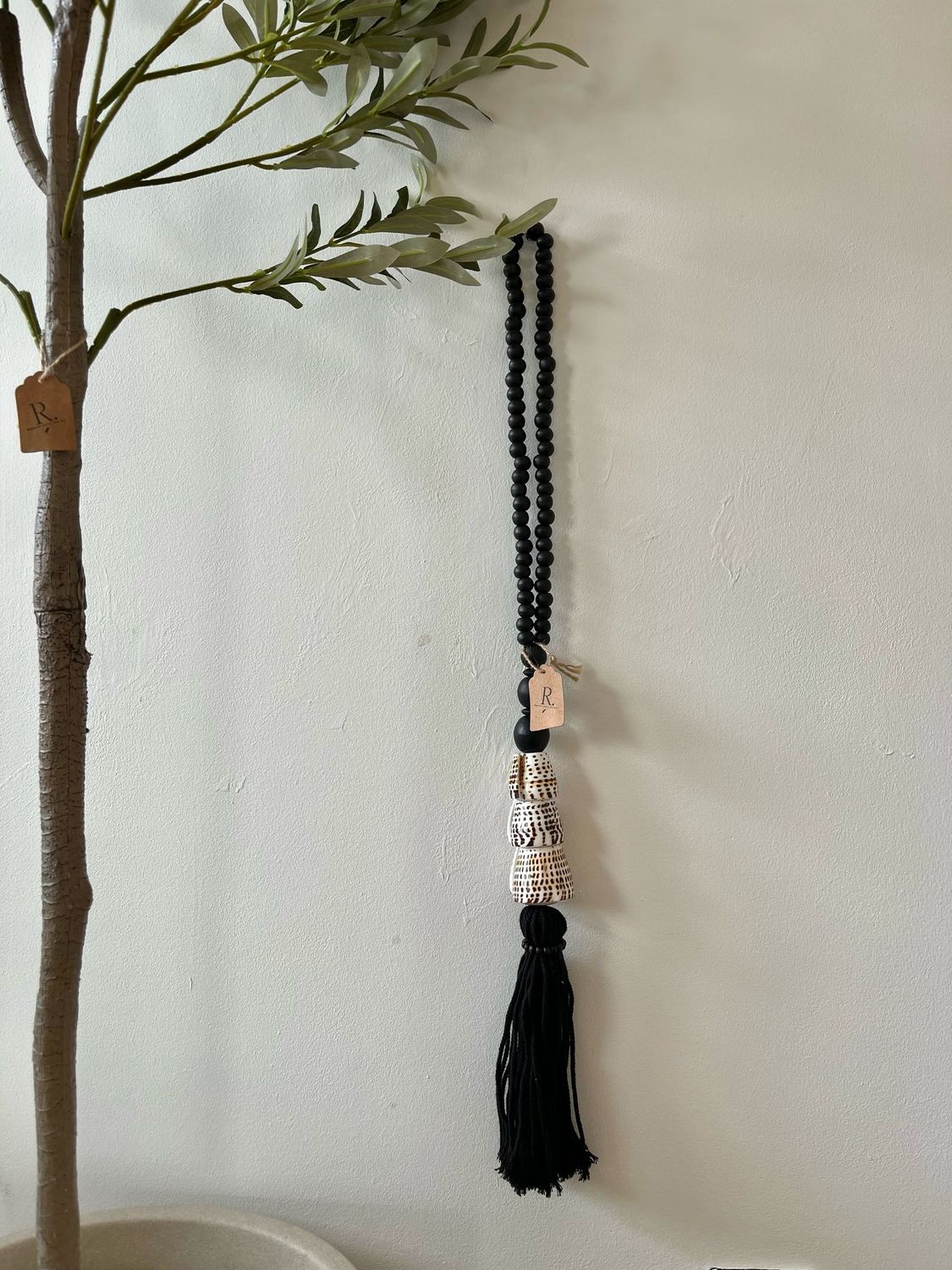 Schelpen tassel zwart