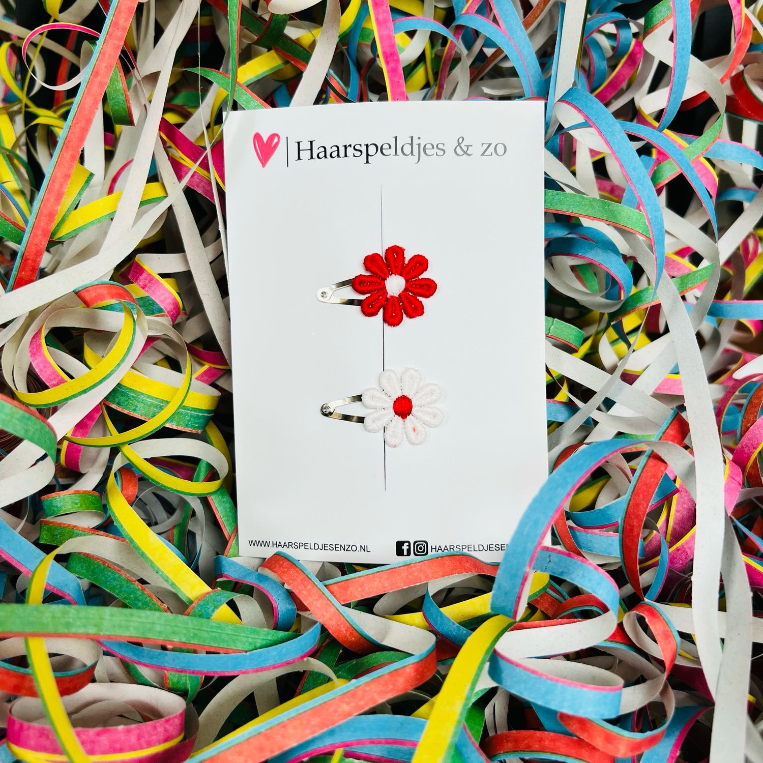 Klikklakspeldjes met rood/witte madeliefjes - carnaval - Ut Malse Arckeldurp — 3 cm