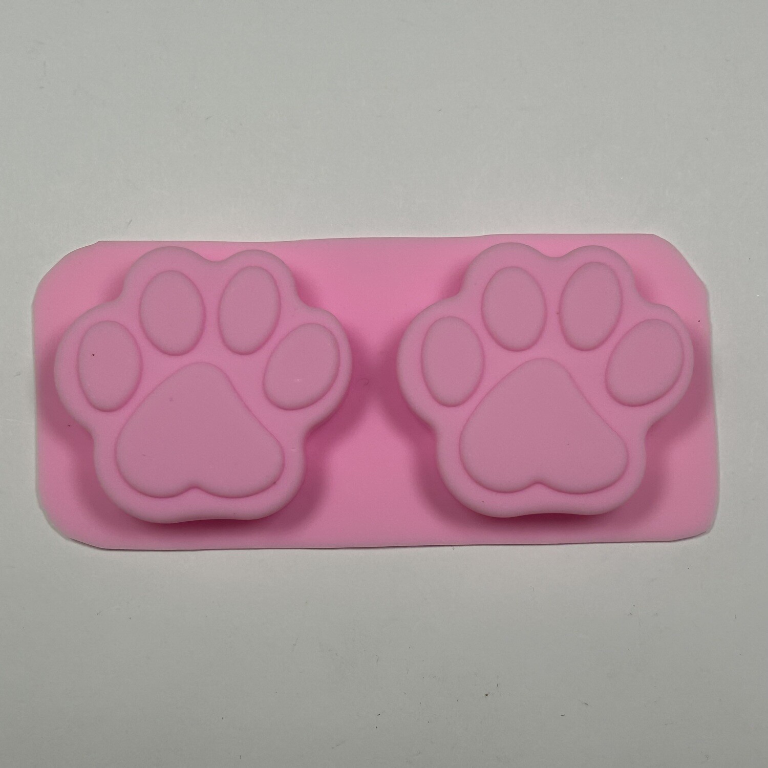 Molde de silicon de huellitas de perro planas brillantes.