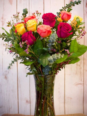 Dozen Colourful Roses in a Vase