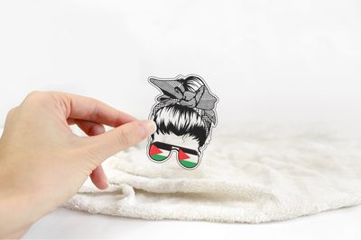 Woman With High Bun and Sunglasses