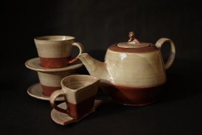 Teaset with a mournful man