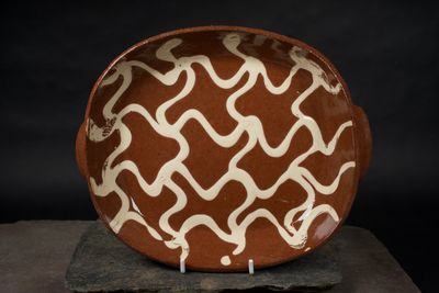 Experimental shallow dish with handles