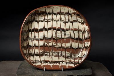 Experimental shallow dish with handles