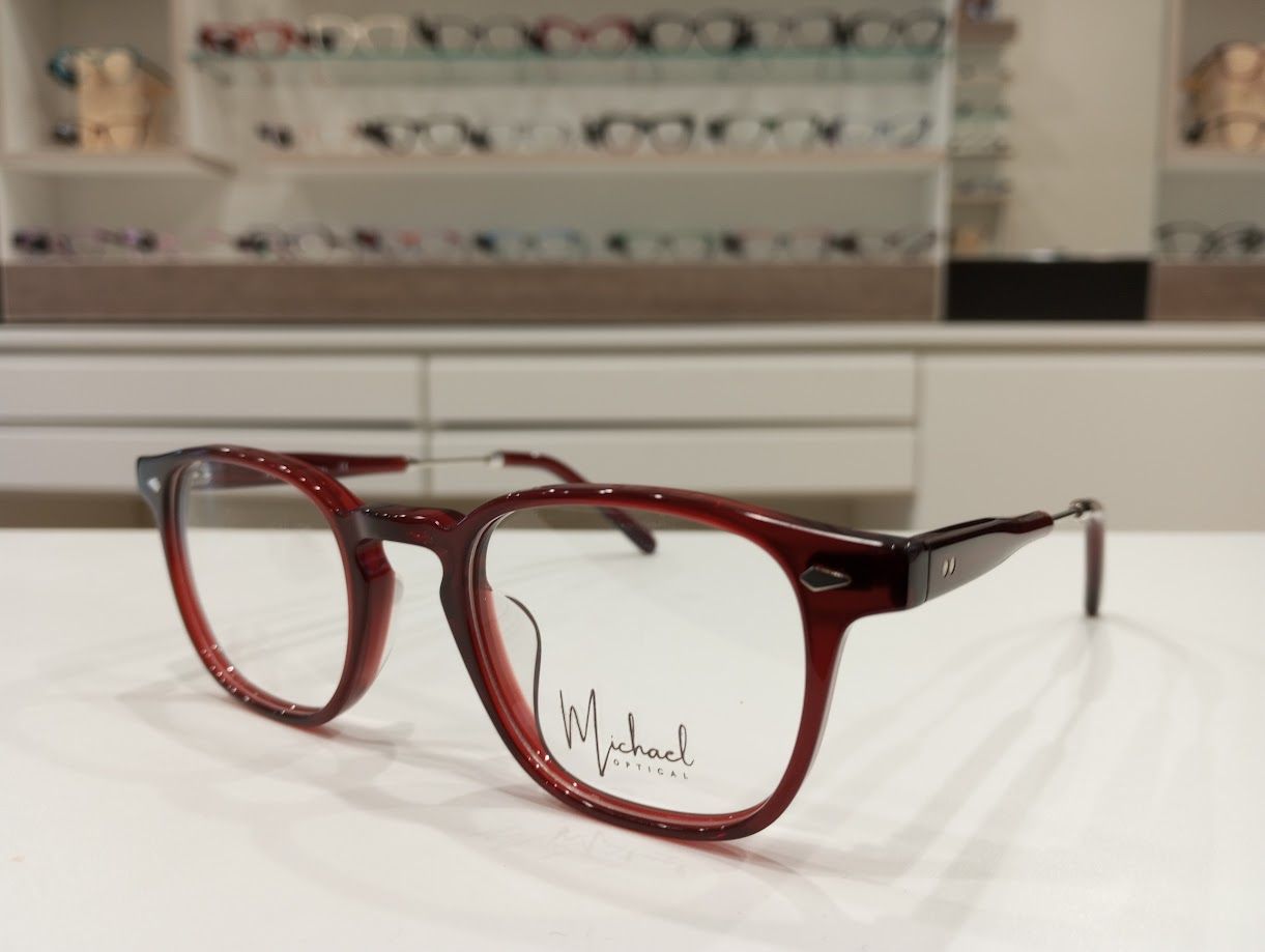 Michael Optical rotondo rosso con asta regolabile