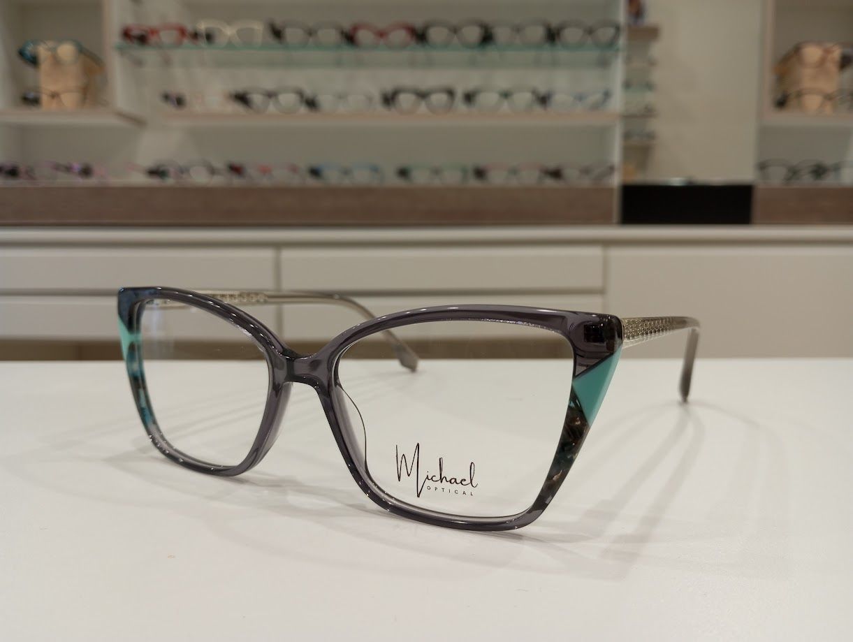 Michael Optical a farfalla grigio azzurro con richiamo ai fiori