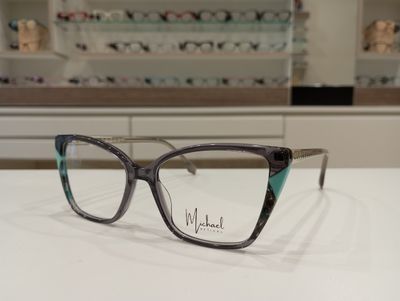 Michael Optical a farfalla grigio azzurro con richiamo ai fiori