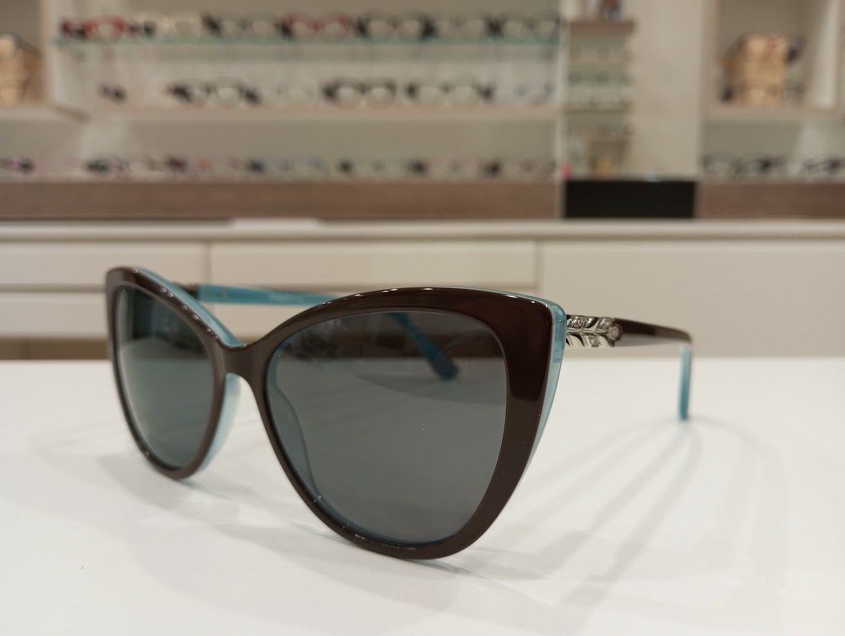 Michael Optical da sole a gatto maculato-azzurro con forma a fiore sull'asta