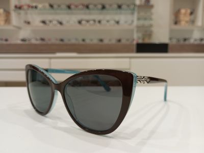 Michael Optical da sole a gatto maculato-azzurro con forma a fiore sull'asta