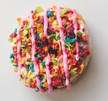 Yeast Donut, Vanilla Icing, Fruity Pebble Topping (Single Donut) Yeast Donut, Vanilla Icing, Fruity Pebble Topping (Single Donut)