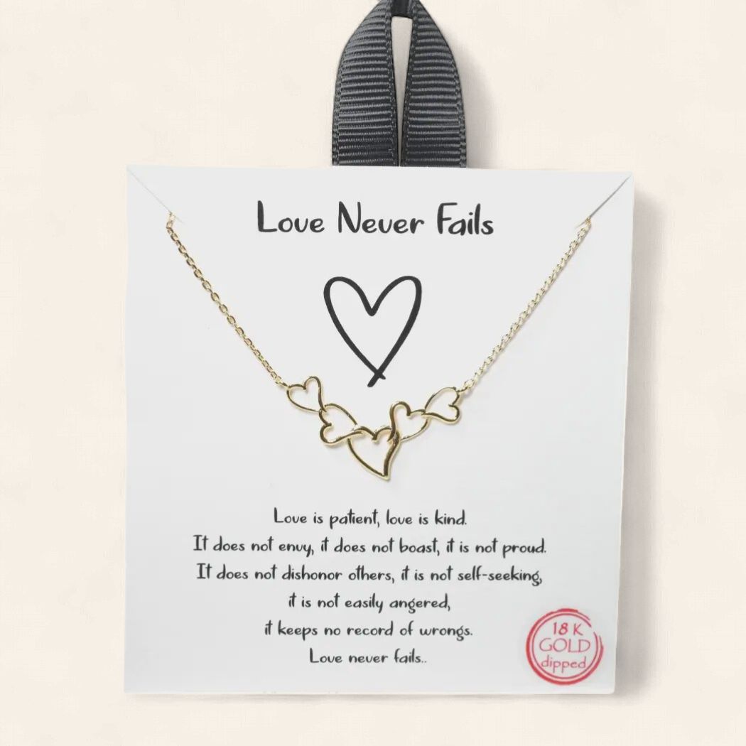 Love Never Fails dainty heart necklace