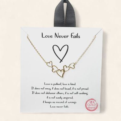 Love Never Fails dainty heart necklace