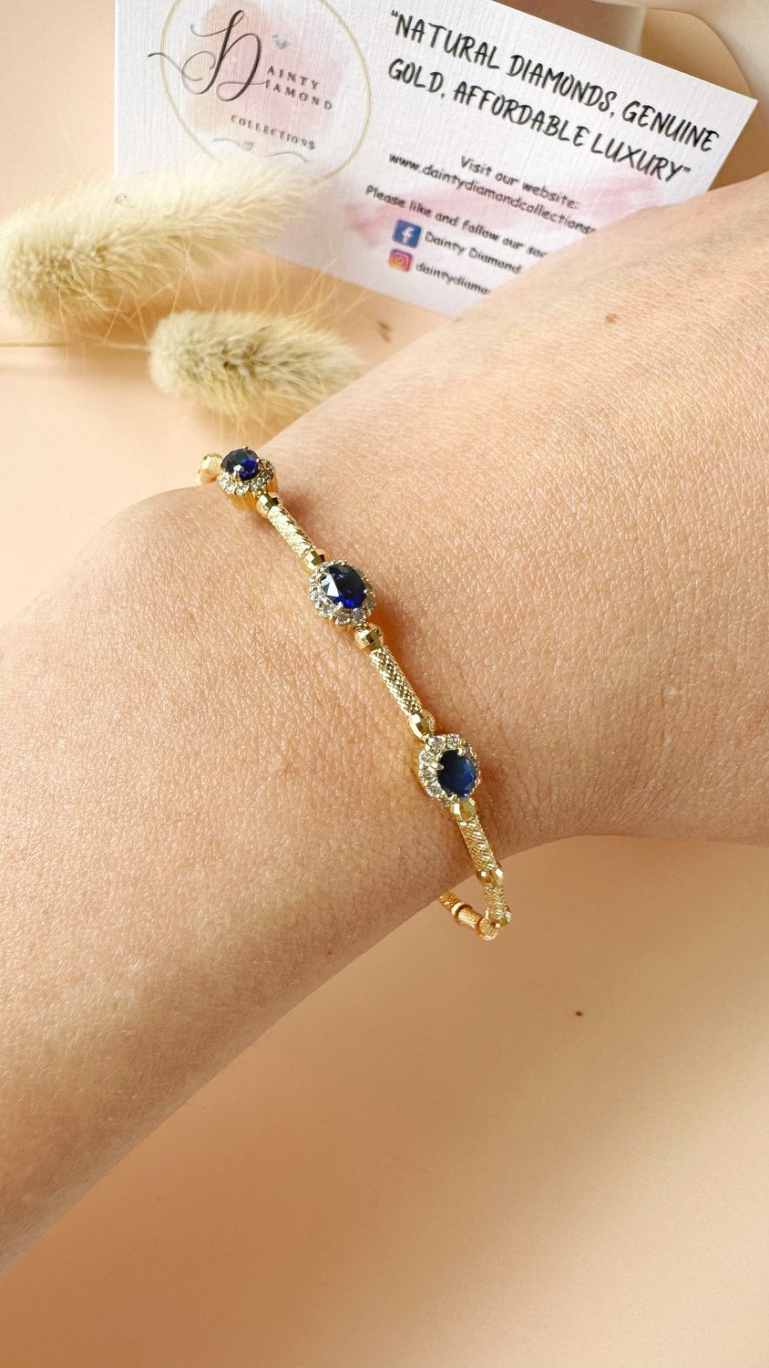 0.70 ct Blue Sapphire, 0.30 ct Dia Bangle YG