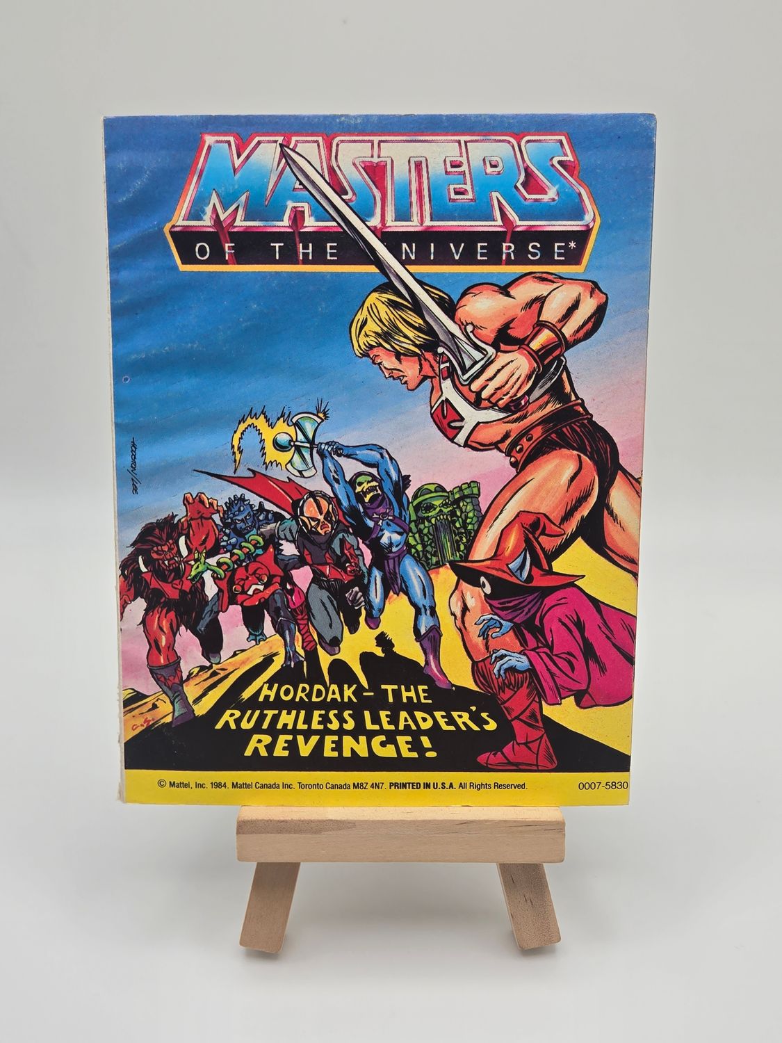 Close-up of the top right corner of the 1984 Masters of the Universe comic book cover, showing He-Man and the series title.