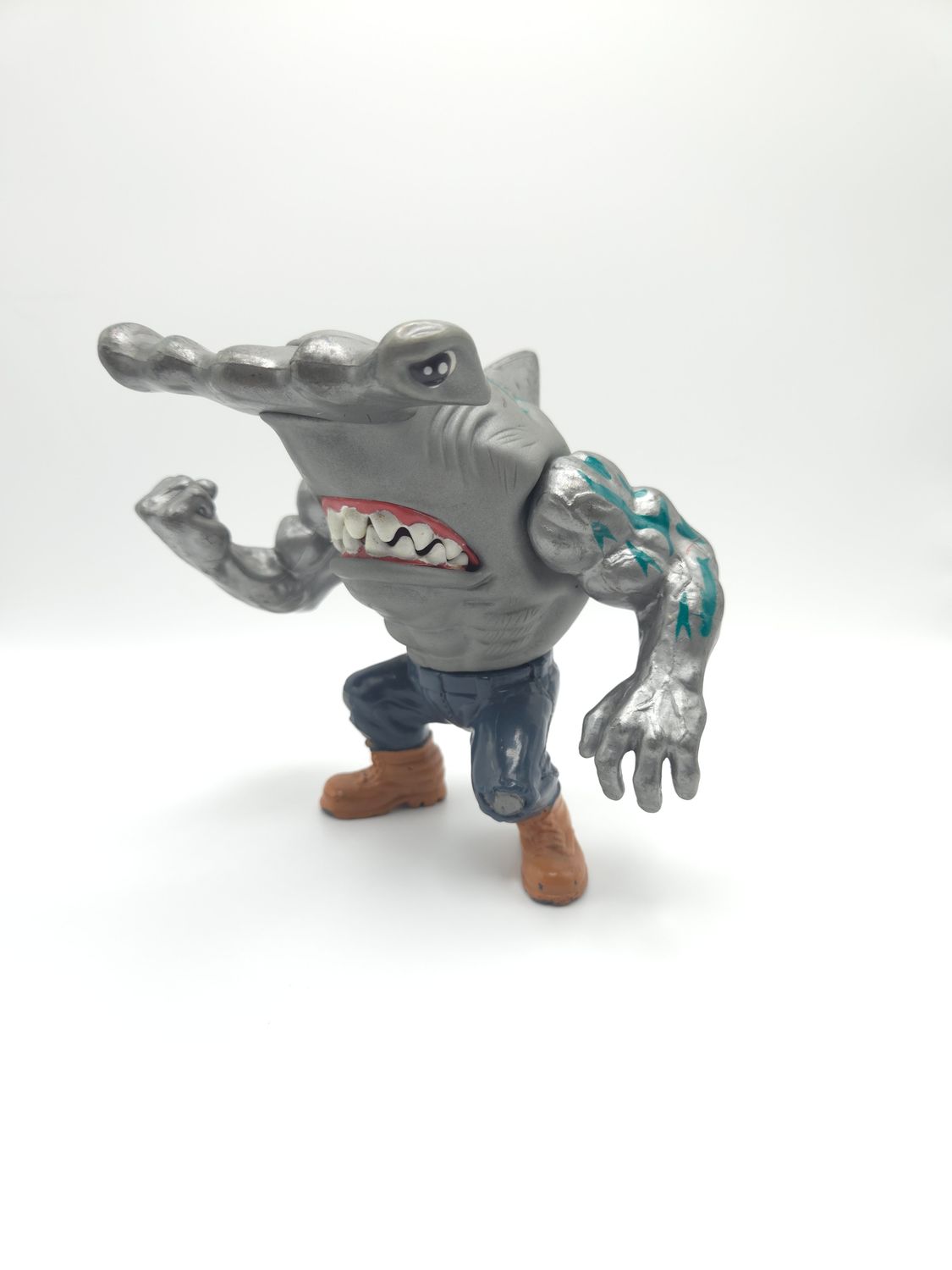 A front-facing view of the 1994 Jab Street Sharks action figure by Mattel. The figure features a muscular hammerhead shark character with jeans and brown boots, ready for action.