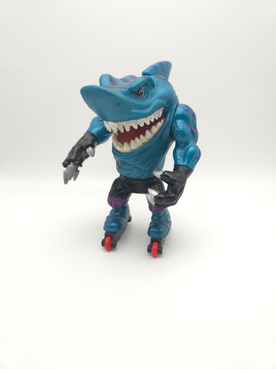 Front view of the figure, displaying the fierce facial expression and sharp teeth.