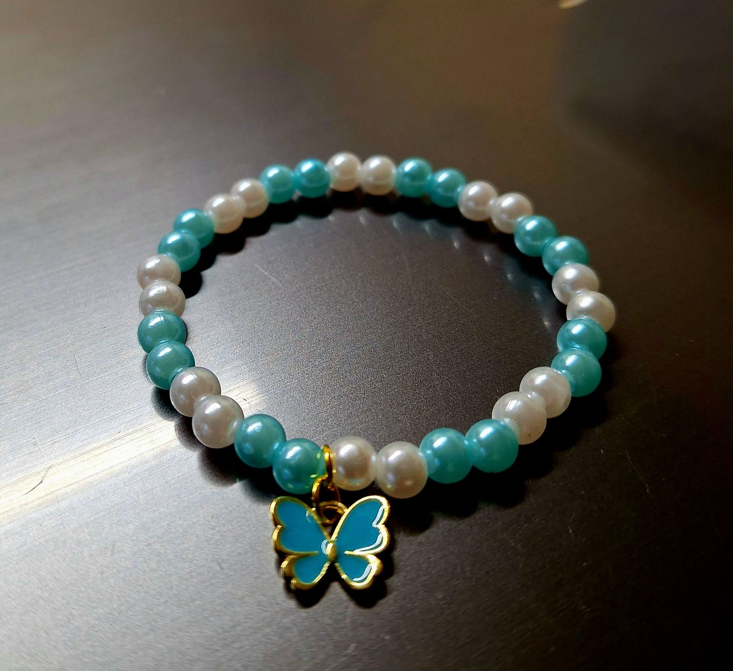 Teal and white butterfly bracelet