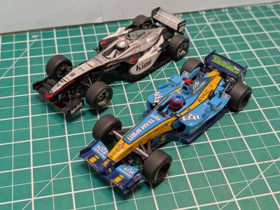 PRE-OWNED Scalextric C2858 2x F1 Cars; McLarem MP4-16 and Renault R24