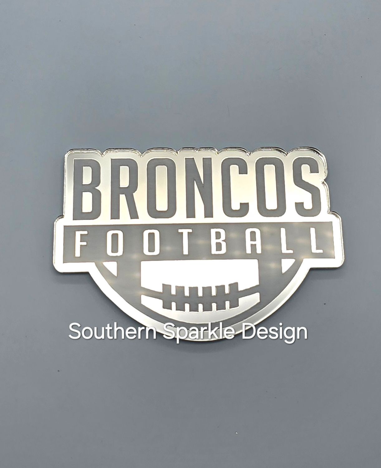 Broncos football with ball on bottom