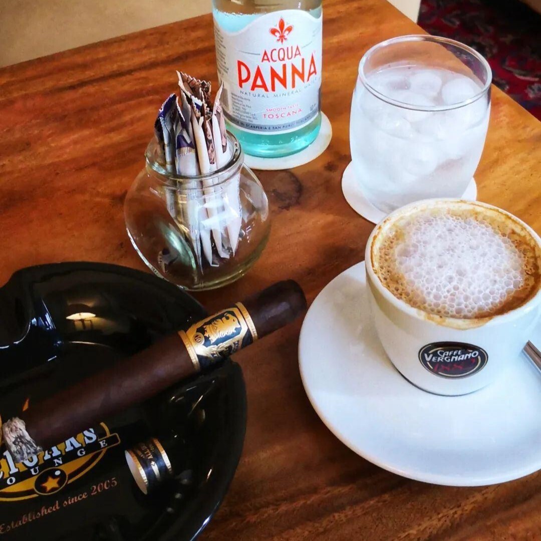 CONSULTATION OVER CIGARS IN HARTAMAS