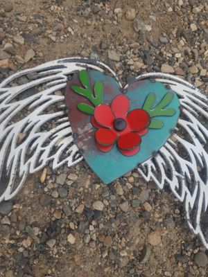 Wings with heart and flower