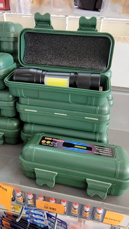 Rechargeable flashlight in green case