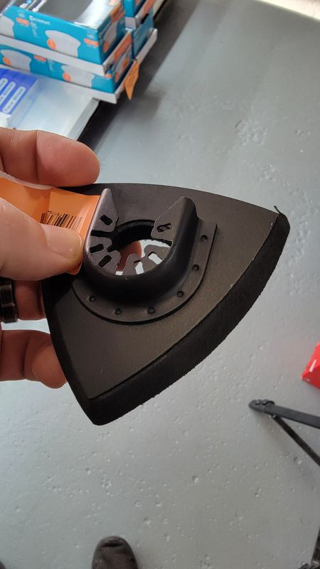 Oscillating tool sanding pad attachment