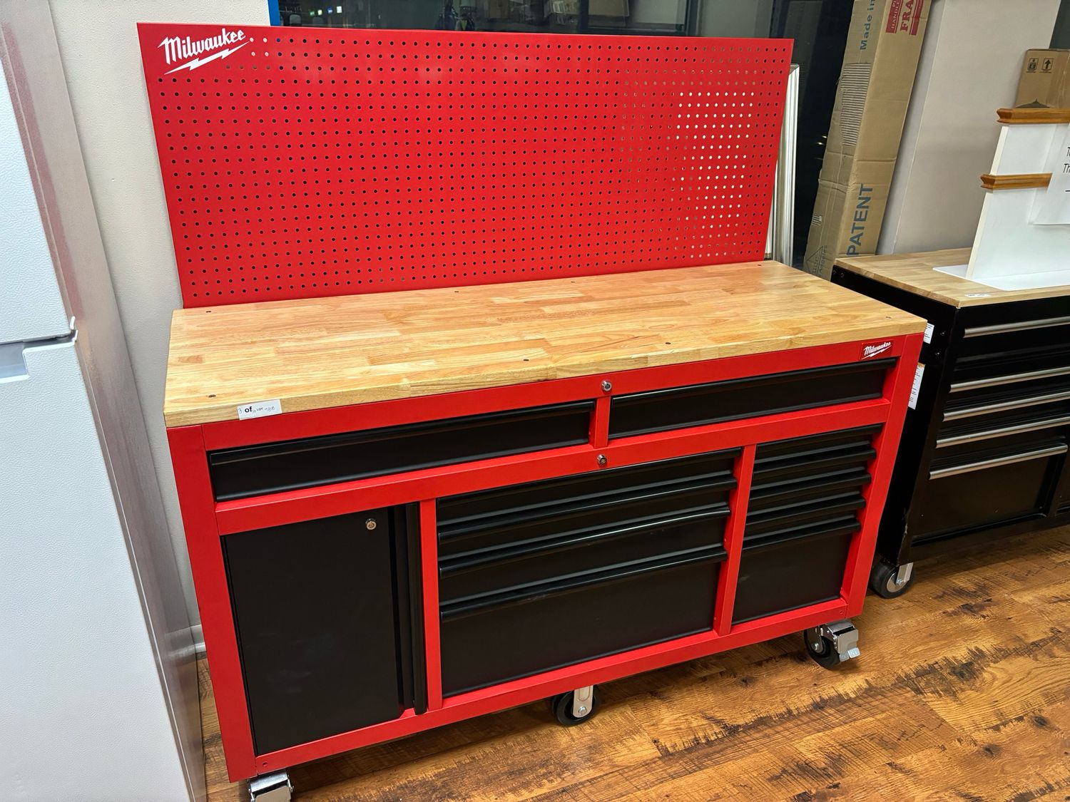 Milwaukee 61 in. 11-Drawer/1-Door 22 in. D Mobile Workbench with Sliding Pegboard Back Wall in Red/Black 48-22-8561