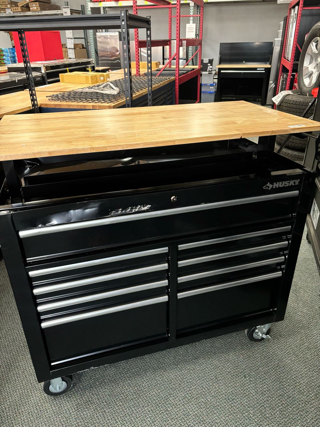 Husky 46 in. x 25 in. D 9-Drawer Mobile Toolbox Workbench with Adjustable Height Wood Top in Gloss Black HOLC4609B11M