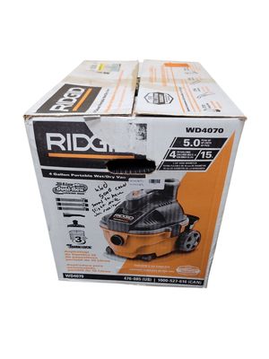 RIDGID 4 Gal. 5.0 Peak HP Portable Shop Vacuum Wet Dry Vac with Fine Dust Filter, Locking Hose and Attachments WD4070 .