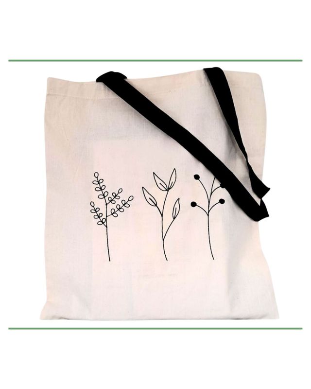 neutral cotton tote bag with long black handles and embroidered leaves in black thread