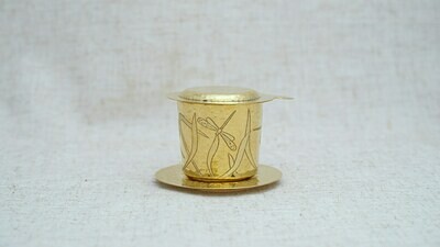 Reaching Out bronze coffee filter with dragonfly carve
