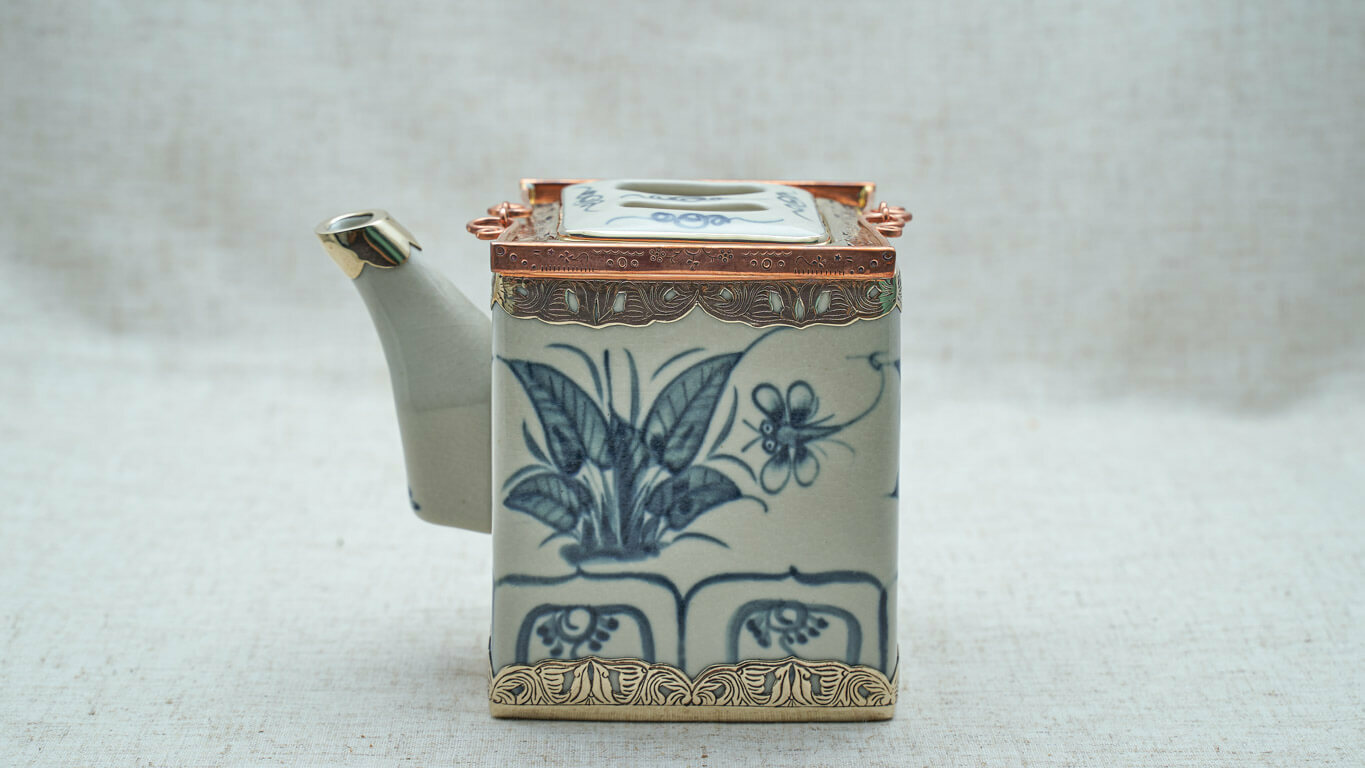 Cubic teapot with dragonfly motifs