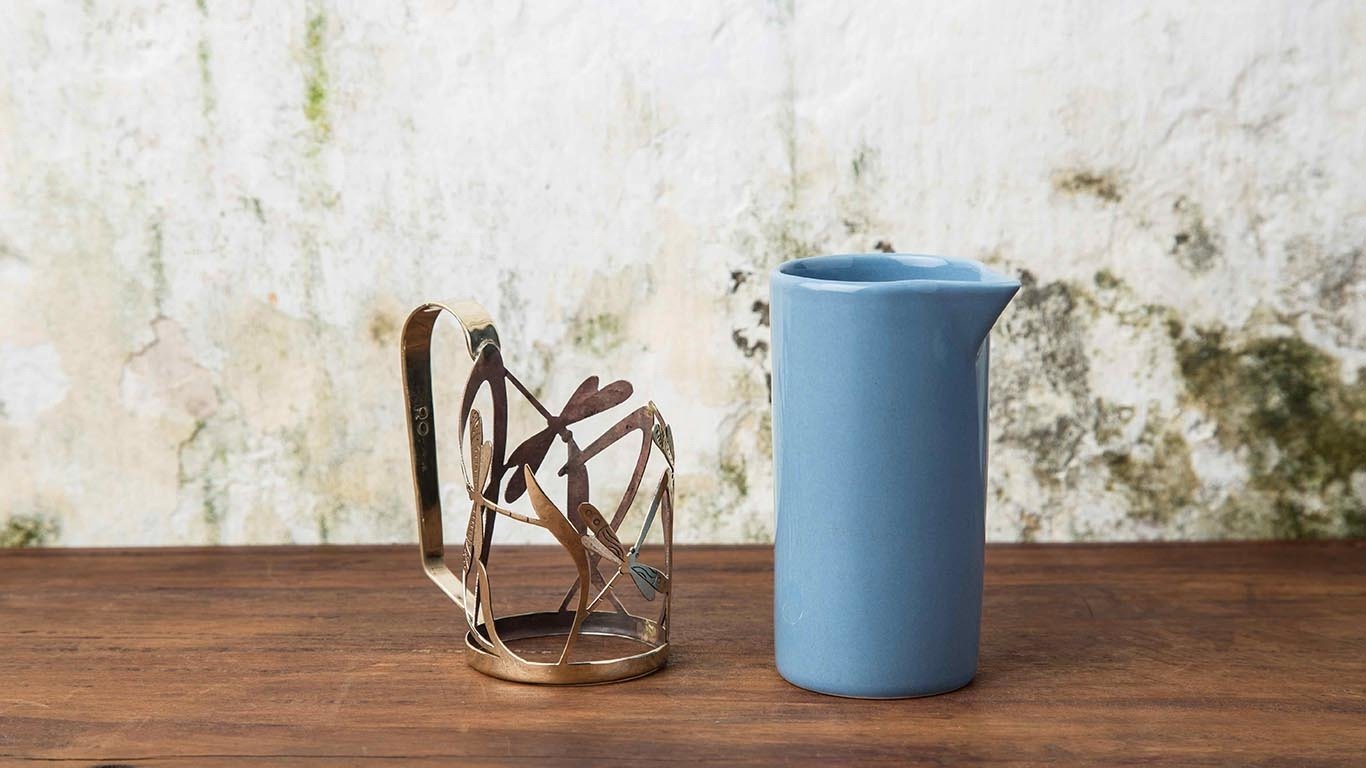 Milk jug with bronze holder