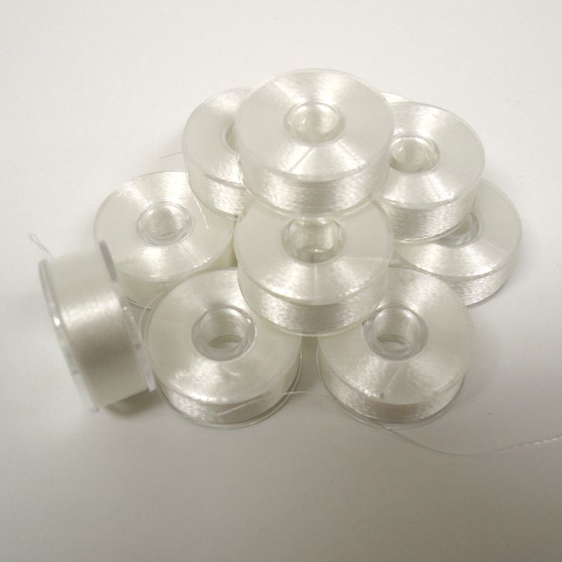 One Dozen Plastic-Sided Bobbins