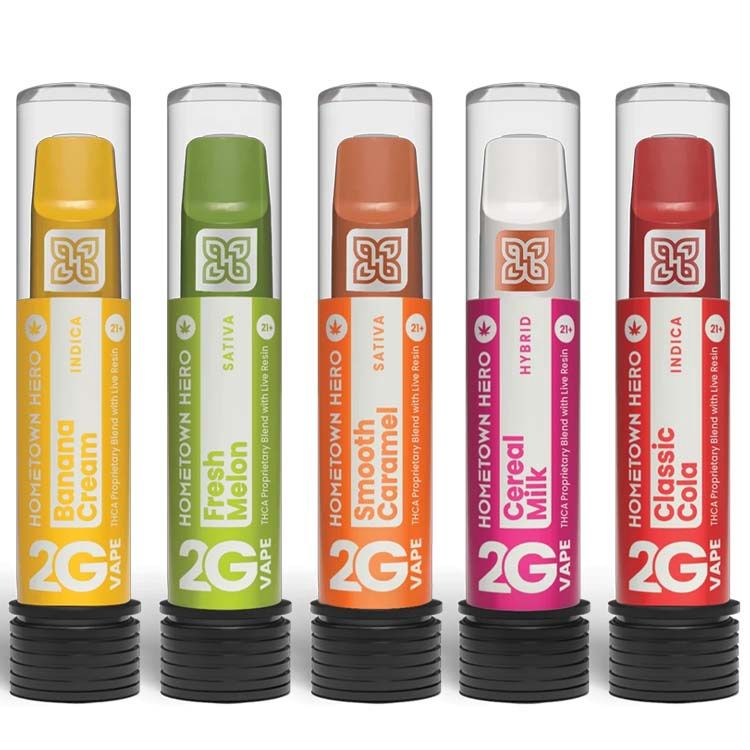 Group shot of Hometown Hero 2g THCA disposable vapes in five flavors: Cereal Milk, Smooth Caramel, Fresh Melon, Banana Cream, and Classic Cola