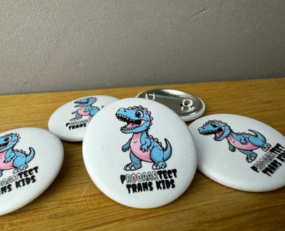 Protect Trans Kids T-Rex - Button 🏳️‍⚧️