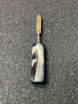 Round black &amp; white tool