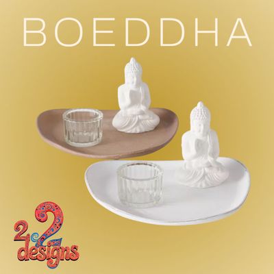Boeddha op blad met waxinelicht