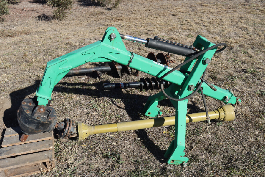 Hydraulic down force post hole digger