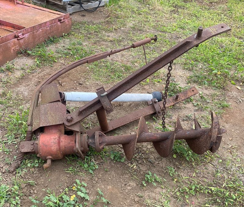 Tractor post hole digger