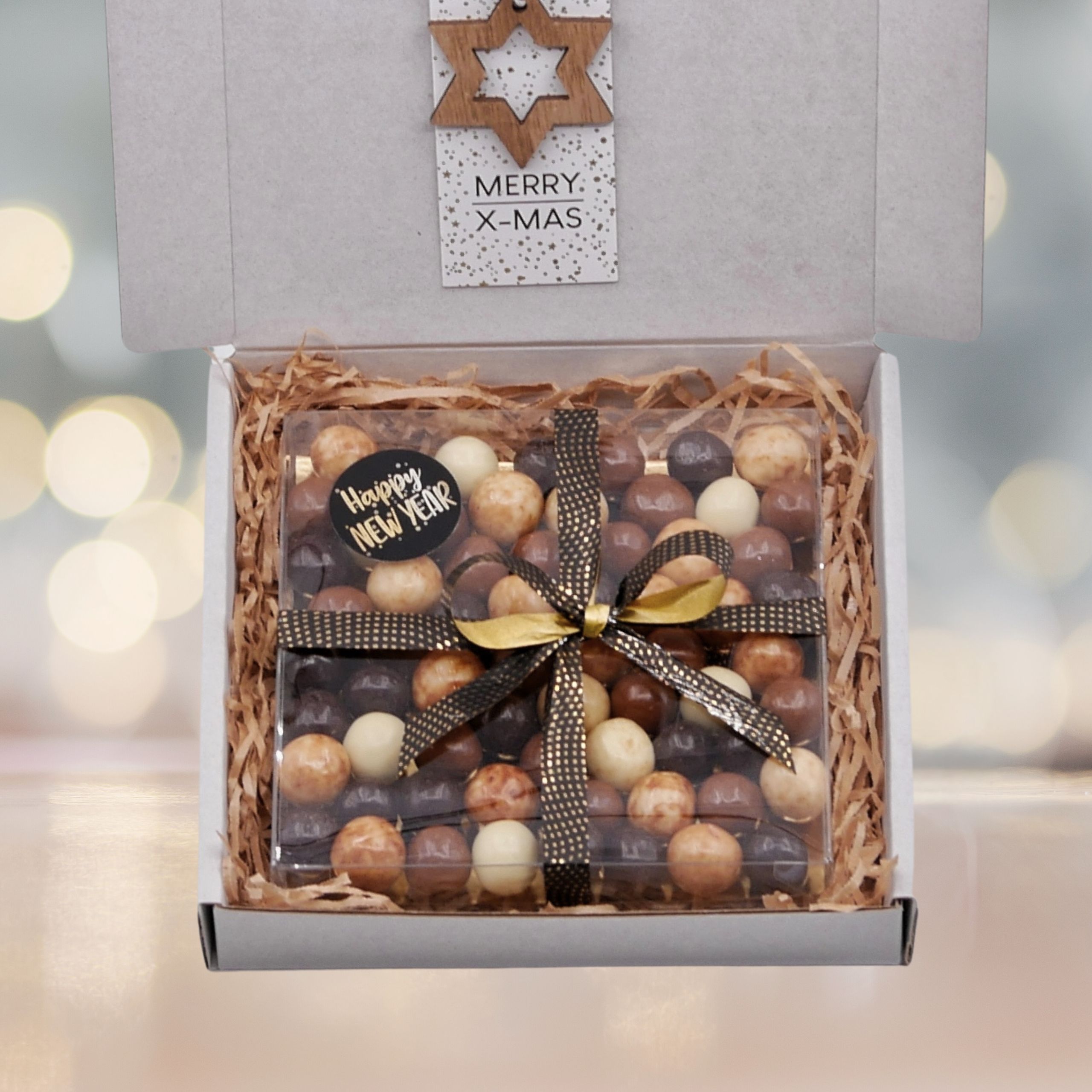 Brievenbuscadeau kerst met een doosje noten of chocolade