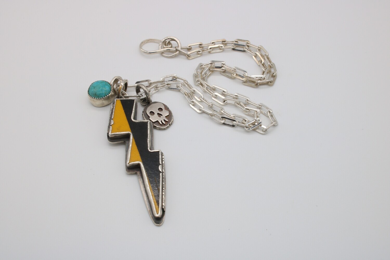 Amuck Design: Lighting Bolt Necklace with skull and turquoise charms
