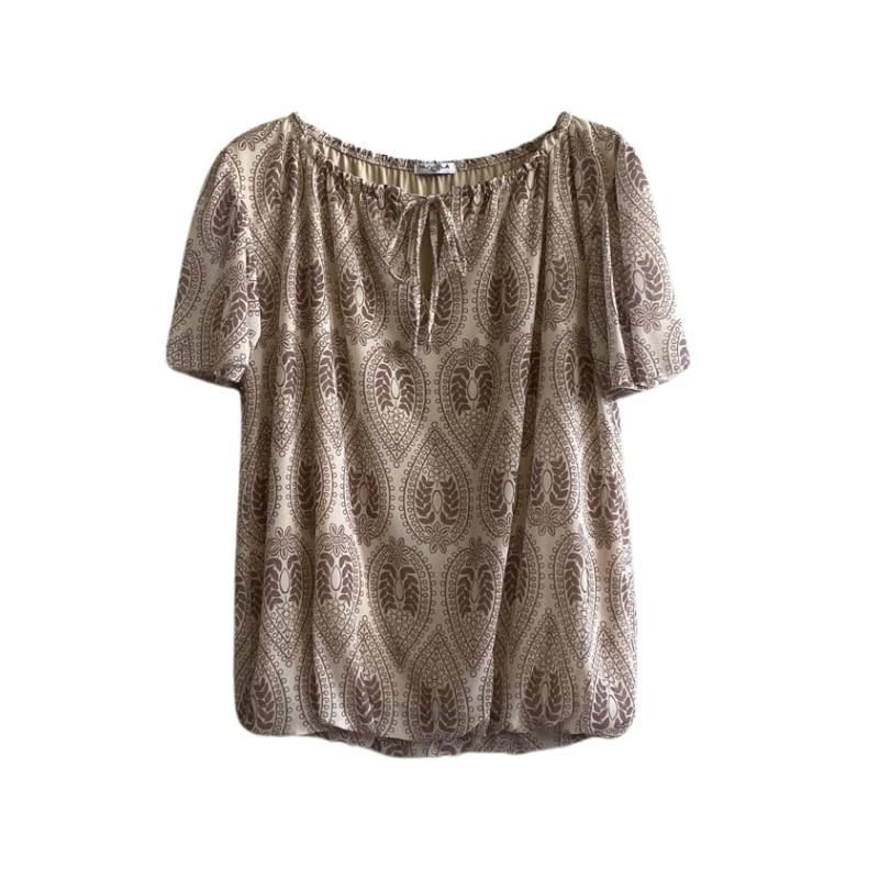 Blusa a maniche corte a fantasia