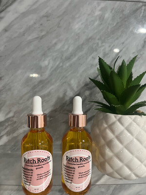2 bottles of Ritch Roots hair oil