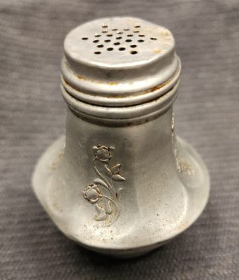 1940&#39;s Aluminum salt shaker with weighted bottom and raised floral design